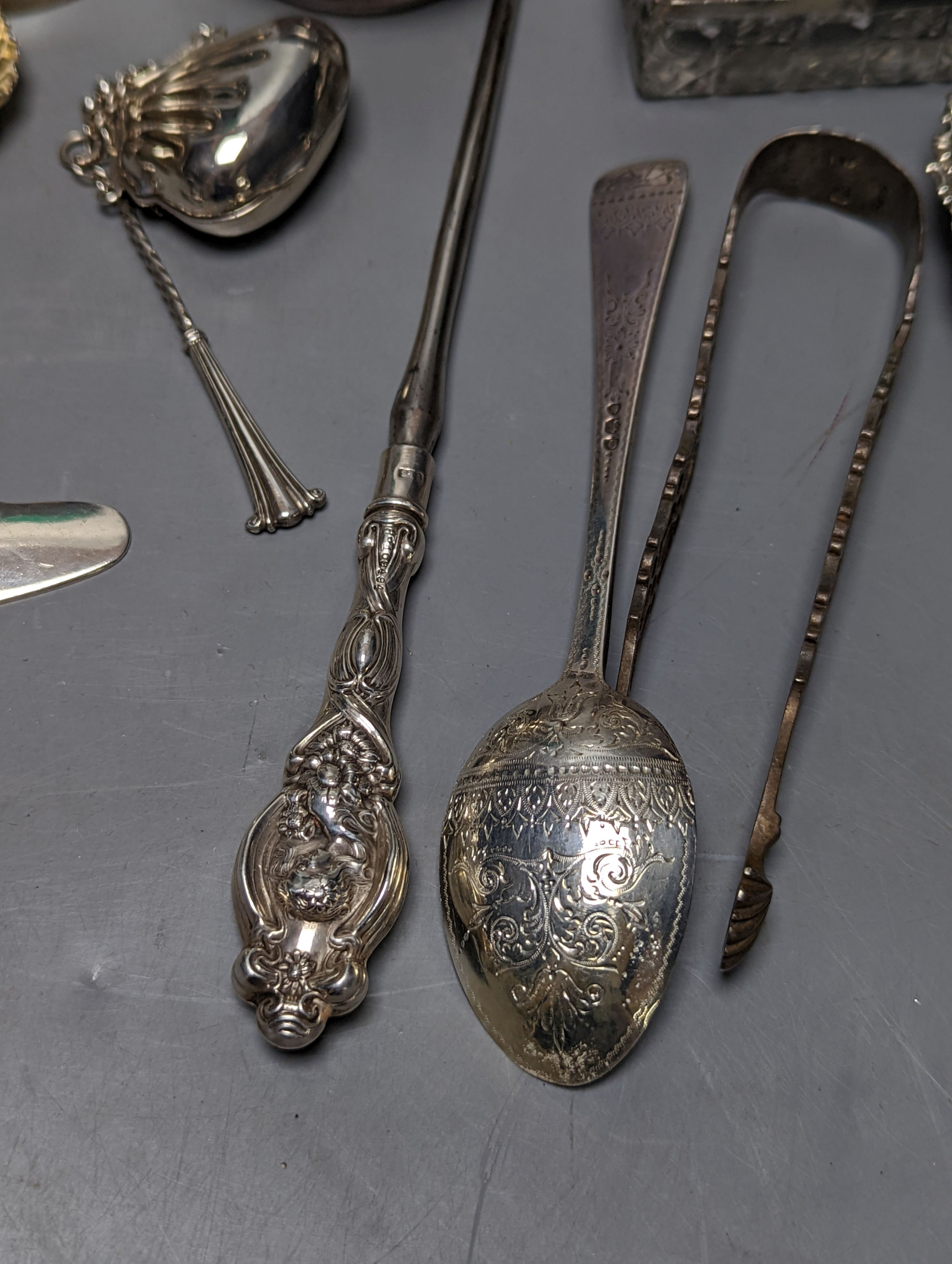 Mixed collectable small silver etc. including silver cream jug, clothes brush, mounted glass posy vase, sugar tongs, owl book mark, spoons and other items.